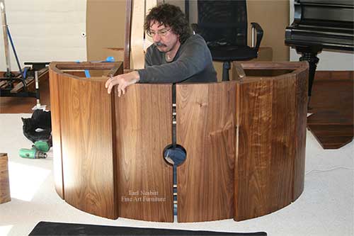 Earl installing walnut base of this unique executive desk